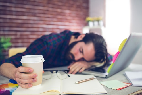 Exhausted Middle Aged Man sees how much stress low repetition training adds to the stress of daily life